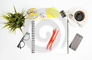 office desk table with computer supplies flower and coffee cup t