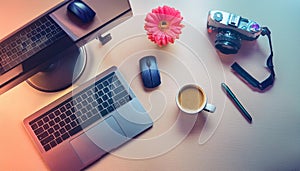 Office desk table with computer, supplies, flower and coffee cup. Top view with copy space