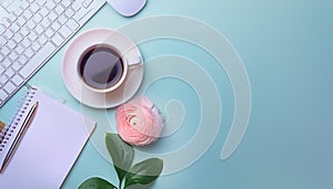 Office desk table with computer, supplies, flower and coffee cup. Top view with copy space