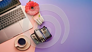 Office desk table with computer, supplies, flower and coffee cup. Top view with copy space