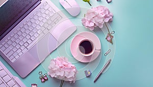 Office desk table with computer, supplies, flower and coffee cup. Top view with copy space