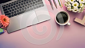 Office desk table with computer, supplies, flower and coffee cup. Top view with copy space