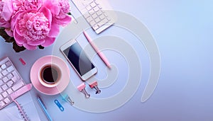 Office desk table with computer, supplies, flower and coffee cup. Top view with copy space