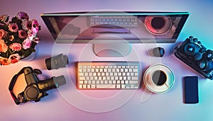 Office desk table with computer, supplies, flower and coffee cup. Top view with copy space