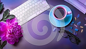 Office desk table with computer, supplies, flower and coffee cup. Top view with copy space