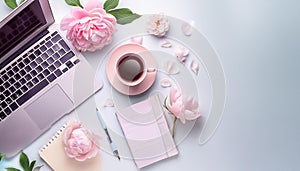 Office desk table with computer, supplies, flower and coffee cup. Top view with copy space