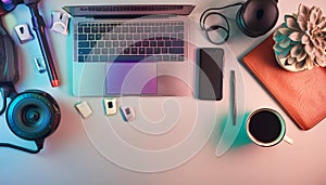 Office desk table with computer, supplies, flower and coffee cup. Top view with copy space