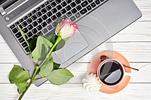 Office desk table with laptop and coffee cup