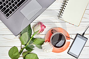 Office desk table with laptop and coffee cup