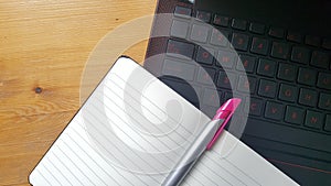 Office desk table with laptop and notebook