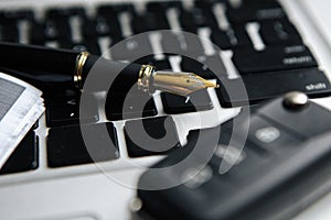 Office desk table top view no people with laptop, notepad, pen, pen drive, car keys, black coffee cup and earphone.The