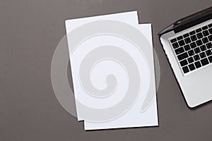 Office desk top view with blank notebook isolated on gray, with clipping path, changeable background