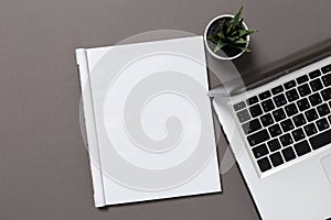 Office desk top view with blank notebook isolated on gray, with clipping path, changeable background