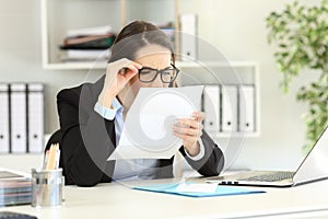 Office employee having eyesight problems photo
