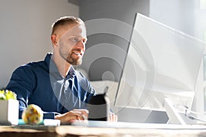 Office employee working at desktop computer
