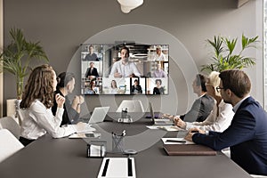 Office employees and freelancers meeting on online video chat