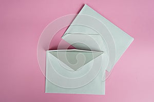 Office envelopes on pink background
