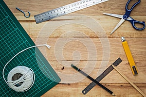 Office equipment or diy tools on wood board