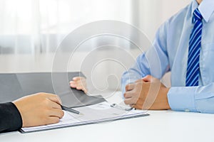 Office executives hand holding pen and interviewing job applicants in the meeting room. employer conversation summary work