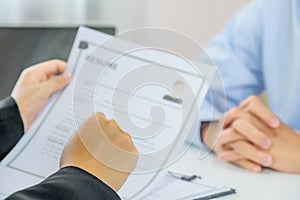 Office executives hand holding pen and interviewing job applicants in the meeting room. employer conversation summary work