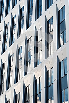 Office facade with windows and sky reflection