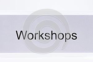 Office folder with the label workshops