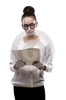 Office girl in glasses holds papers in hands isolated on white