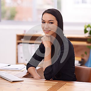 Office, happy and portrait of business Asian woman at desk with confidence, pride and positive attitude. Professional