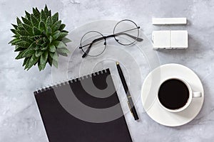 Office or home table desk Blank cubes calendar Mockup template for your calendar date. Black notepad, cup of coffee