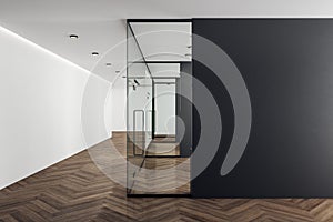 Office interior with blank black wall