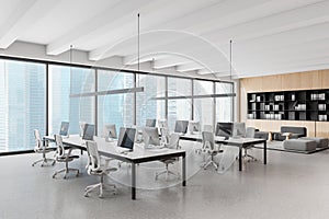 Office interior with coworking and lounge zone, shelf and panoramic window