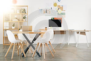 Office interior design, workspace building and desk table with wood chairs. Industrial professional room, concrete floor