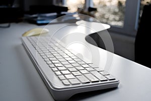 Office Keyboard with Sunset View Through Window