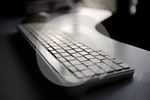 Office Keyboard with Sunset View Through Window