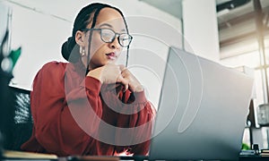 Office, laptop and business woman reading, planning and focus on project review, online report feedback or research