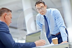 Office laptop, team and portrait of businessman review finance portfolio, stock market database or investment. Economy