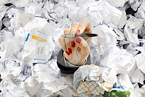 Office life or job stress in a hard day with businesswoman hand covered with documents to be signed