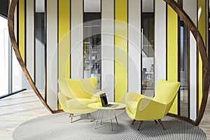 Office lounge with yellow armchairs close up