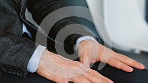 Office man apprehension hands rubbing tapping