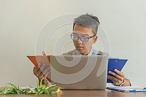 Office man checking financial report in the office