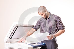 Office man making copies of documents photo