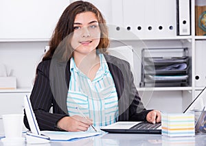 Office manager woman is having productive day at work