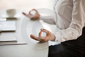 Office meditation for reducing work stress concept, female hands photo