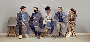 Office multiracial people in casual wear resting on in restroom.