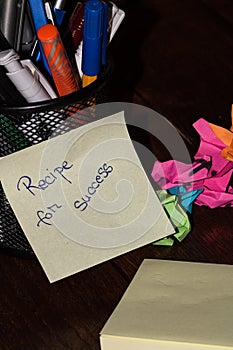 Office objects and sticky note or post it with text Recipe for success