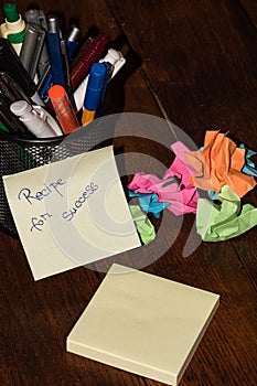 Office objects and sticky note or post it with text Recipe for success