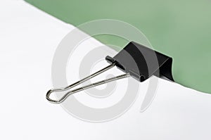 Office paper with black clip