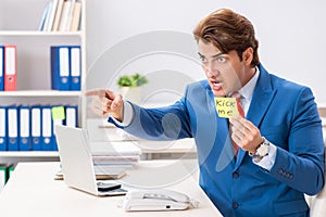 The office prank with kick me message on sticky note