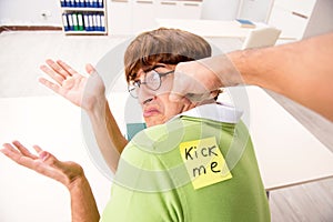 The office prank with kick me message on sticky note
