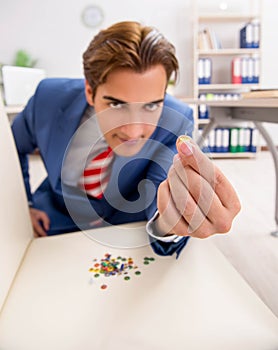 Office prank with sharp thumbtacks on chair